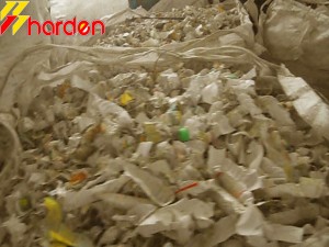 Flakes of chemical plastic containers after shredding